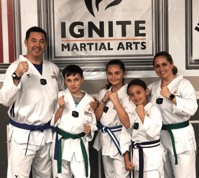 ignite martial arts family program, family posing together