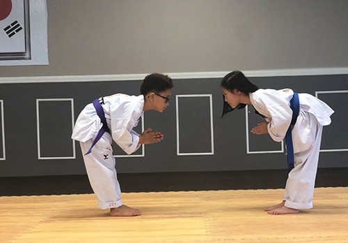 ignite martial arts kids bowing to each other