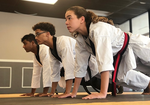 ignite martial arts students doing push ups